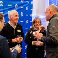 Guests chat at the dinner